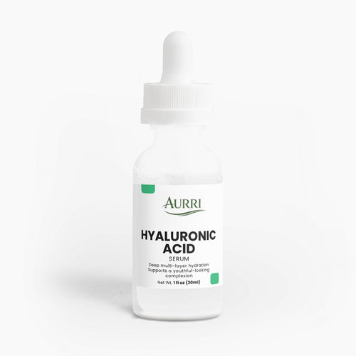 Clear dropper bottle of hyaluronic acid serum for skin hydration on white background