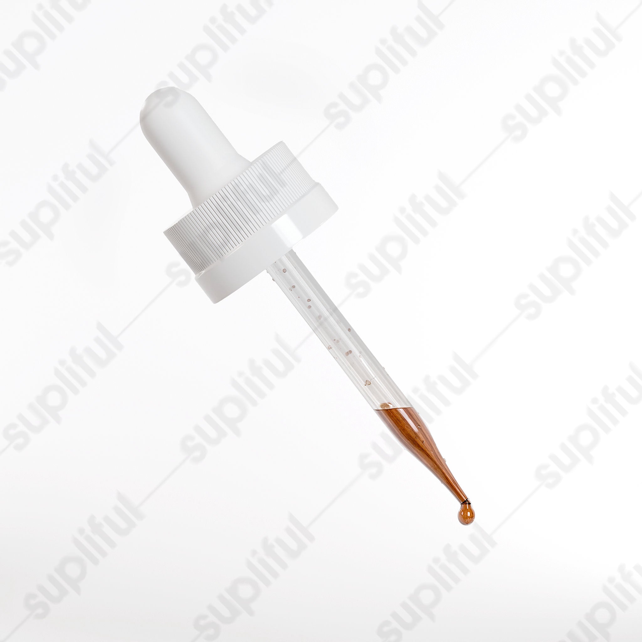 Glass dropper with clear serum and amber drop, isolated on white background